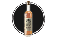 High West bourbon whiskey bottle on dark background.