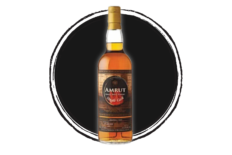 Amrut Single Malt Whiskey bottle on dark background