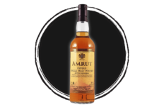 Amrut Indian Single Malt Whisky bottle on black.