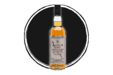 Amrut Two Continents whiskey bottle on black.