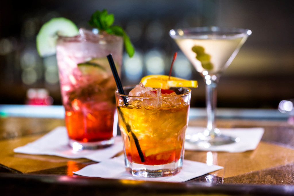 Colorful cocktails on the bar table - Flask & Barrel