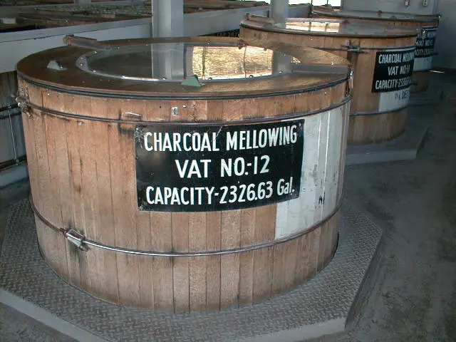 Charcoal mellowing vat in whiskey distillery.