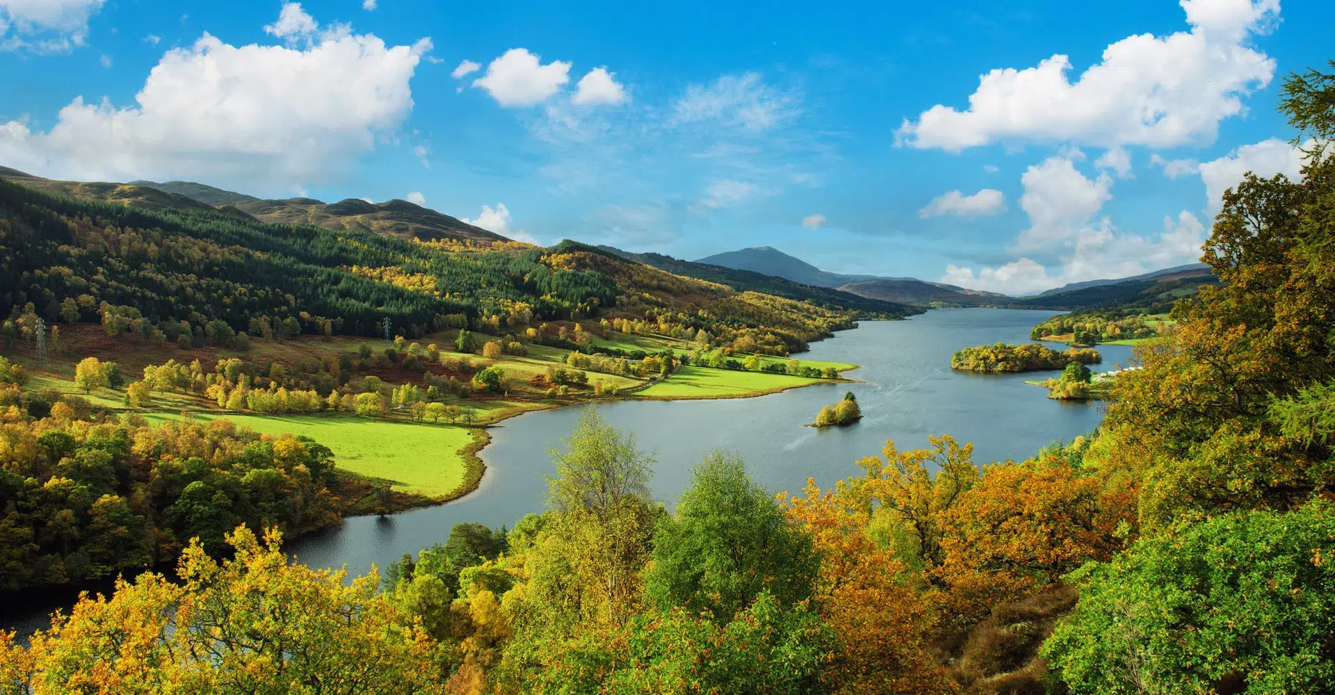 Panoramic autumn lake and forest landscape.
