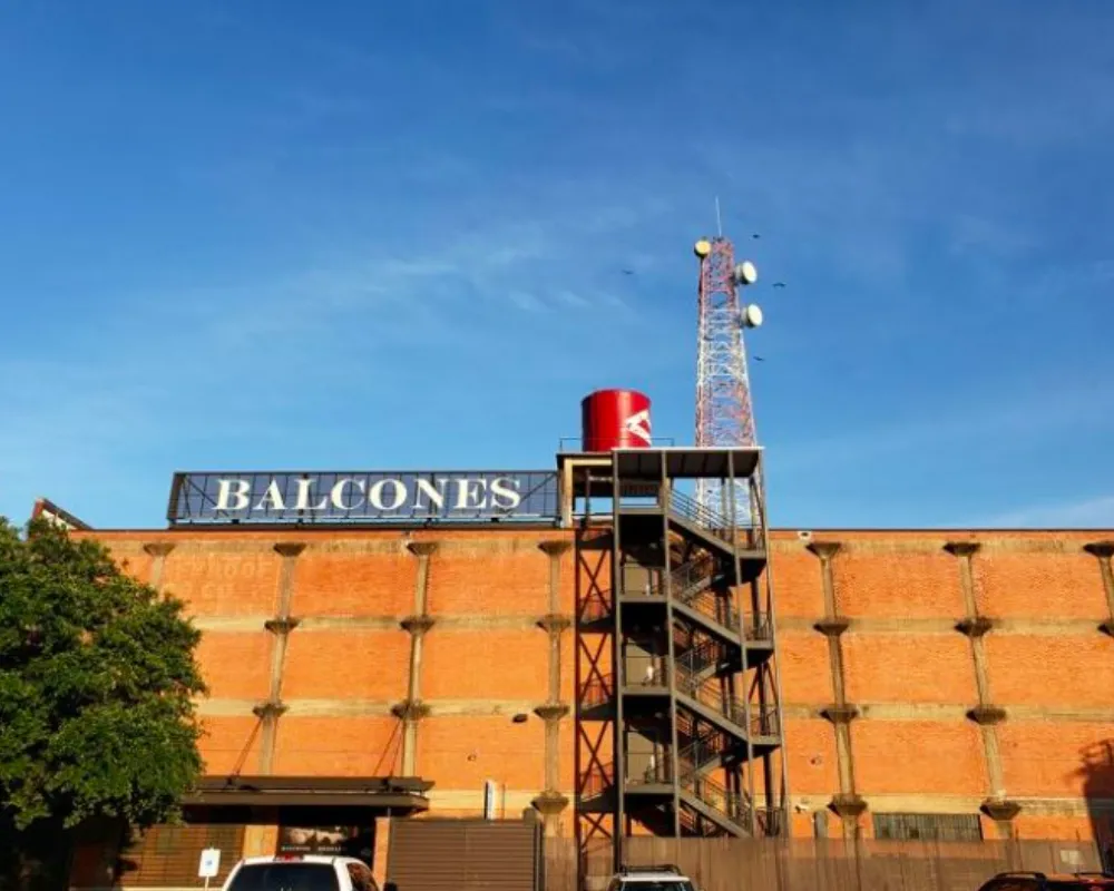 Balcones Distillery brick building with tower and blue sky