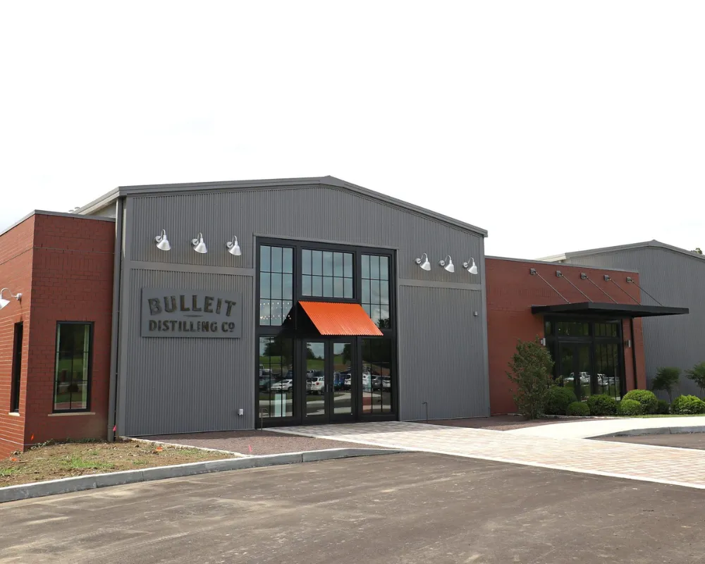 Bulleit Distilling Co. exterior with logo on building facade.