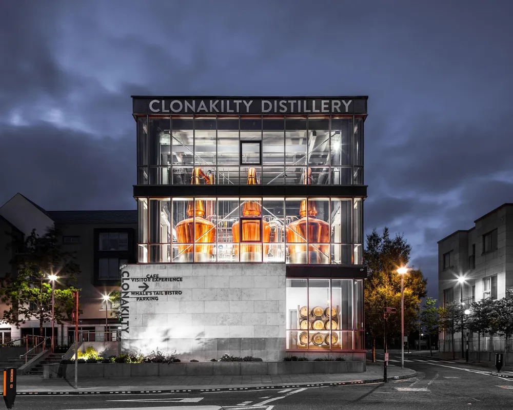 Clonakilty Distillery exterior at dusk.