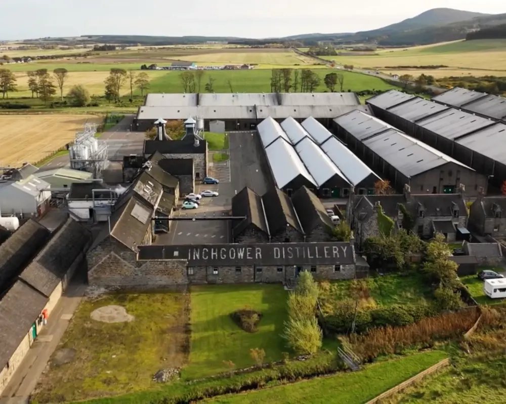 Aerial view of Inchgower Distillery in rural landscape.
