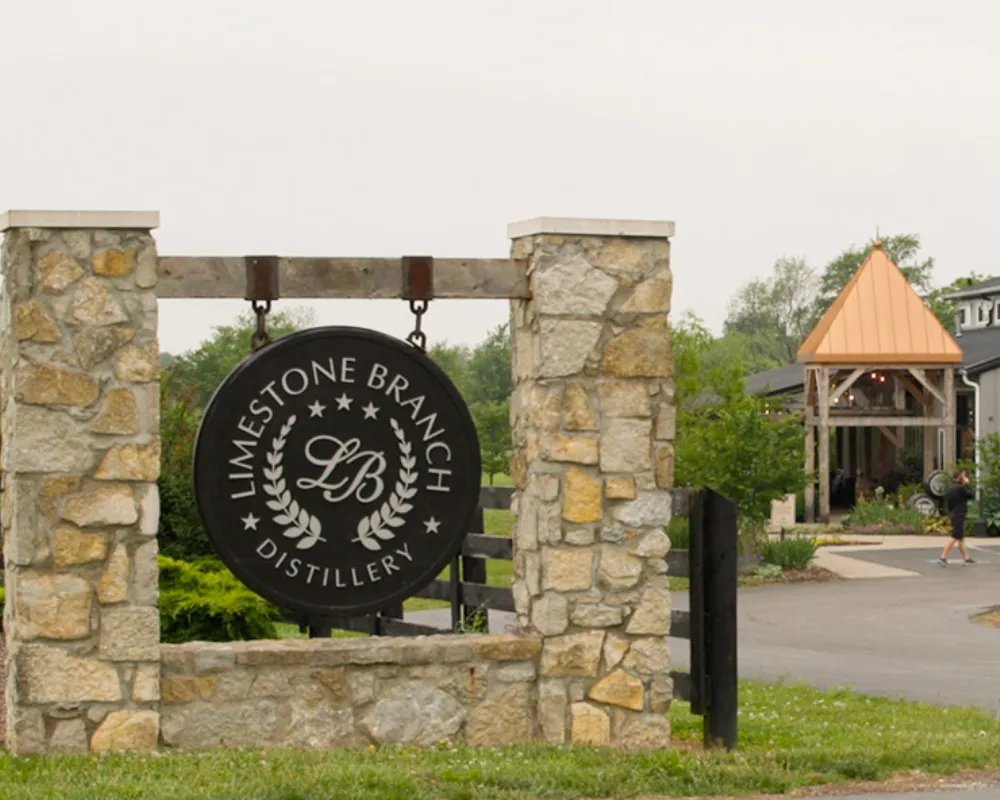 Limestone Branch Distillery entrance sign and building.