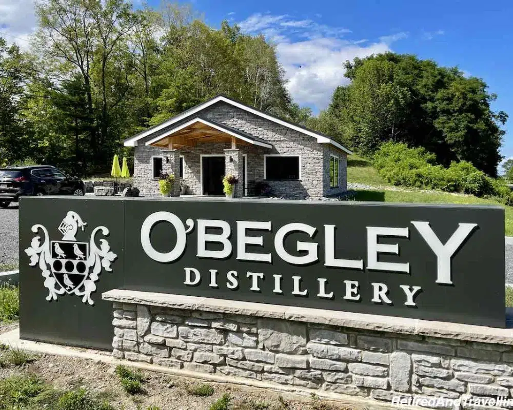 O'Begley Distillery entrance sign with building.