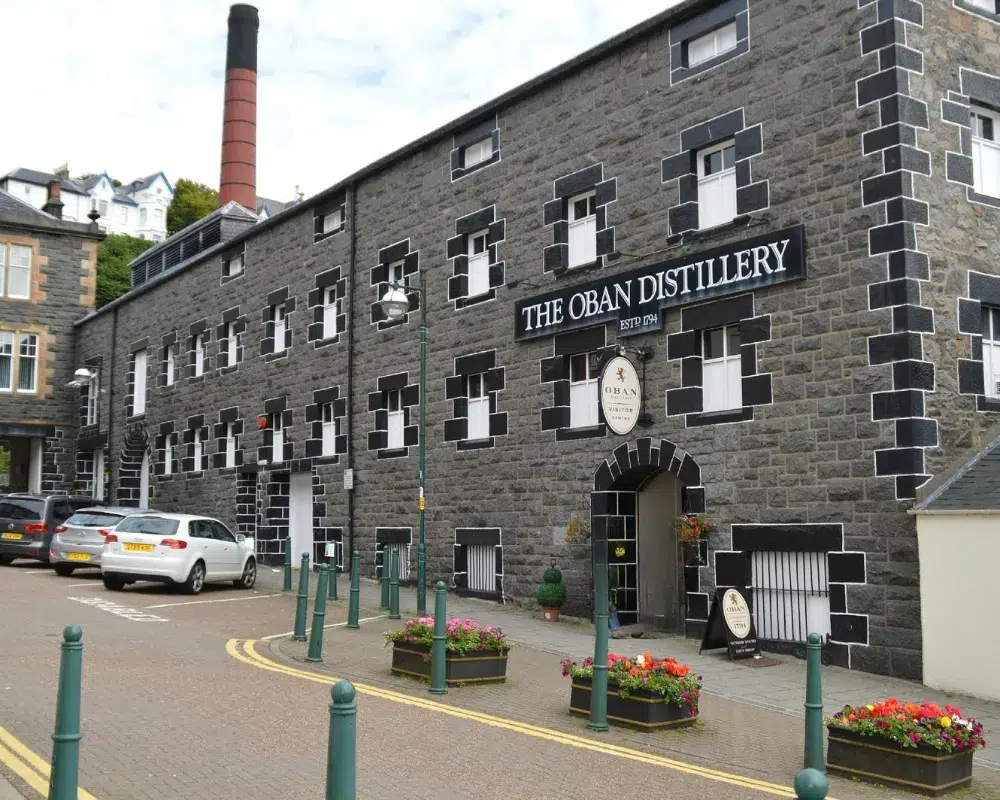 Oban Distillery exterior with stone facade and flower planters