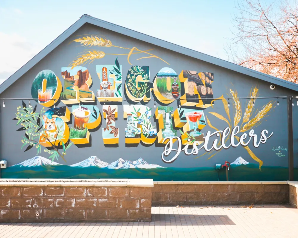 Colorful distillery mural with nature and beverage elements.