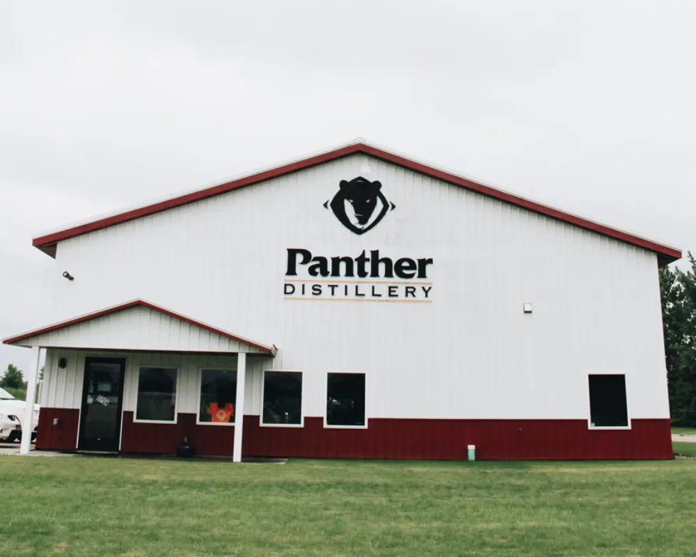 Panther Distillery exterior with logo on building.