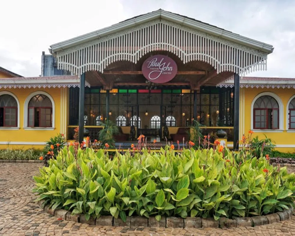 Colorful colonial-style restaurant with lush garden.