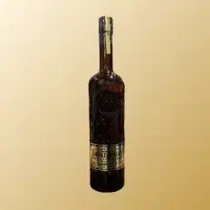 Smoke Wagon Uncut Unfiltered bourbon whiskey bottle on beige background.