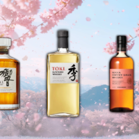 Three Japanese whiskey bottles with cherry blossoms background.