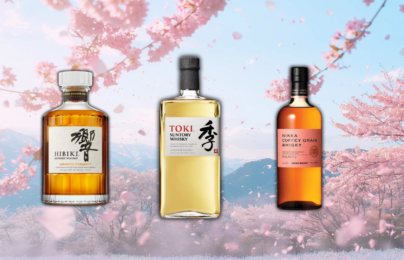 Three Japanese whiskey bottles with cherry blossoms background.