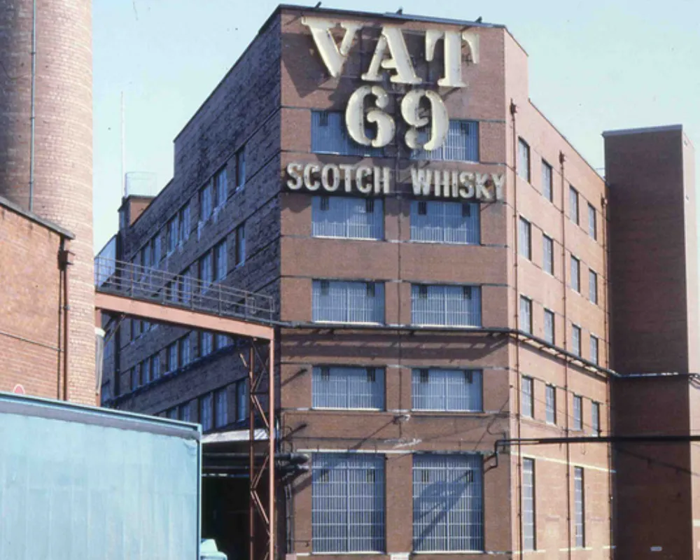 VAT 69 Scotch Whisky sign on distillery building.