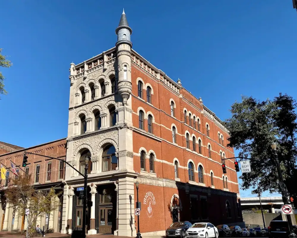 Historic brick tower building under blue sky