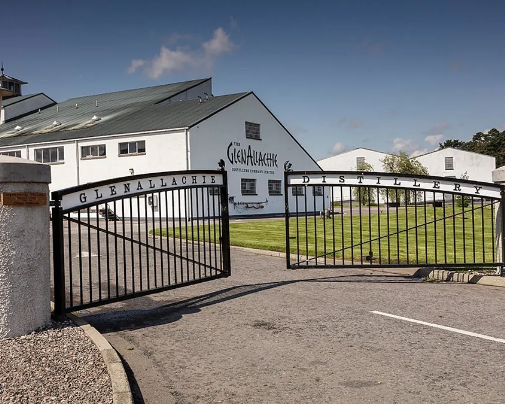 GlenAllachie distillery exterior with open gates.