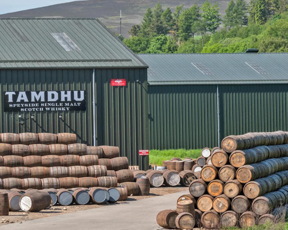 Tamdhu distillery with whiskey barrels, Scotland.