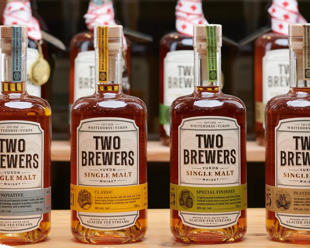 Two Brewers Yukon single malt whisky bottles on display.