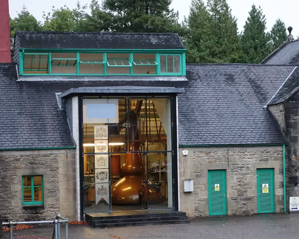 Traditional distillery building with visible copper stills.