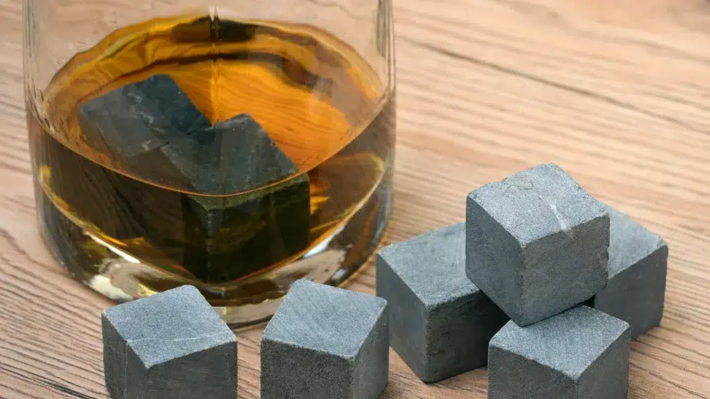 Whiskey glass with granite ice cubes.