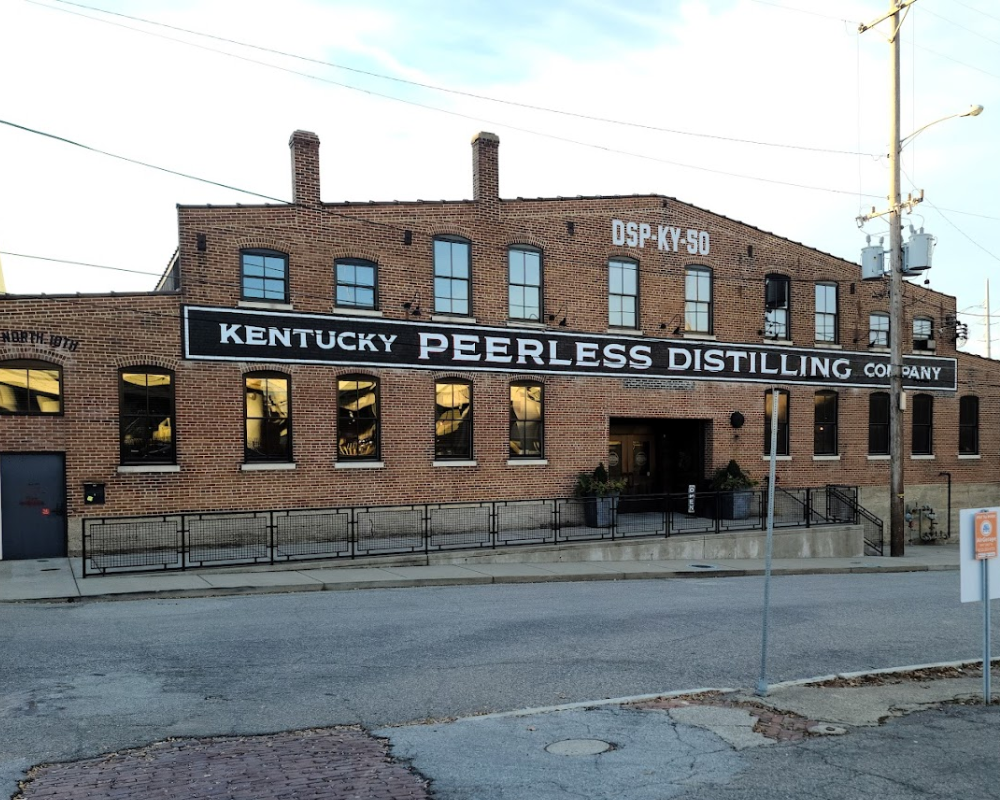 Facade of Kentucky Peerless Distilling Company brick building.