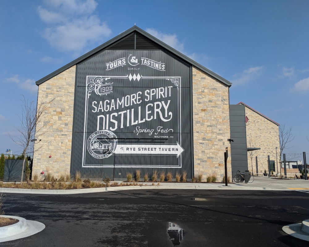 Sagamore Spirit Distillery storefront with directional sign.