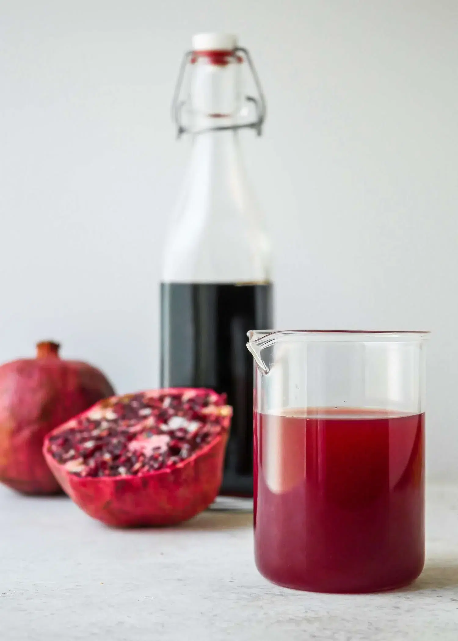 Pomegranate juice in glass and bottle