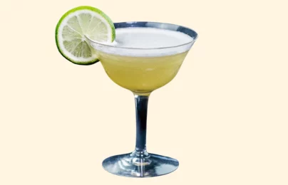 Cocktail with lime slice garnish