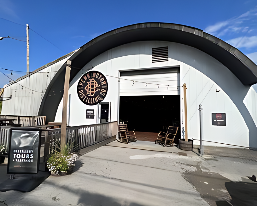 Distillery entrance with tours sign outdoors.