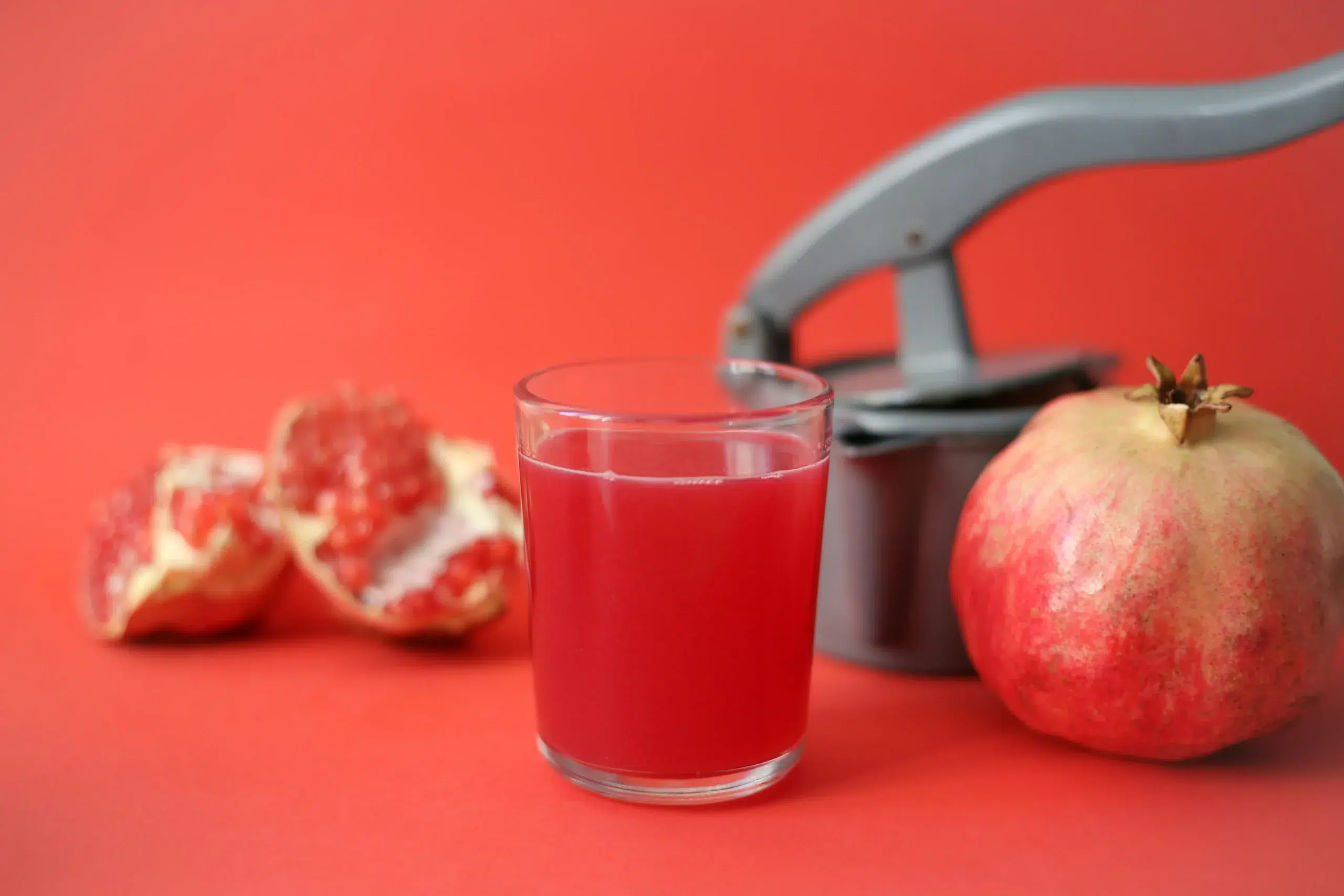 Fresh pomegranate juice and pomegranates