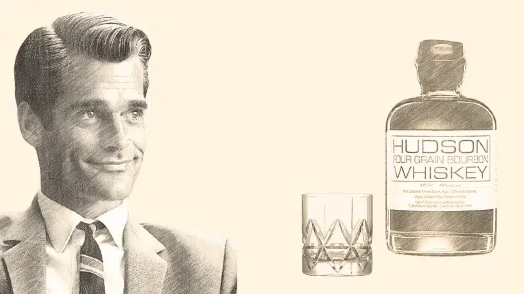 Hudson whiskey bottle and glass beside a man.