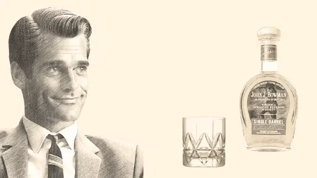 Man smiling beside bourbon bottle and glass.